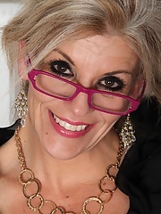 Aged blond woman Sierra Smith in business outfit getting naked and rubbing pussy