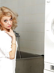 Blonde mature slut doing her laundry