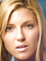 Blonde MILF in high heels flashes naked upskirt