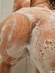 Brunette MILF Violet Smith soaps her big tits and sexy ass