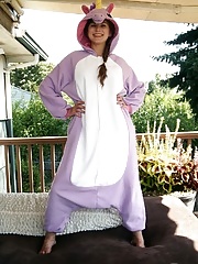 Busty amateur girl in unicorn costume spreads her very hairy beaver