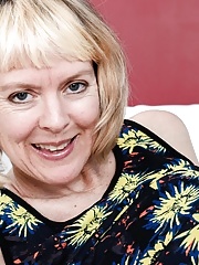 Hot short haired granny with saggy tits taking off her dress and panties