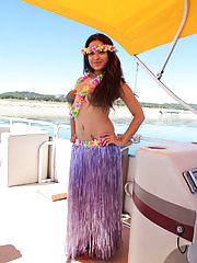 Island girl Vera Waang slips off her coconuts while sailing