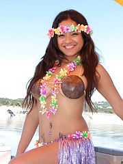Island girl Vera Waang slips off her coconuts while sailing
