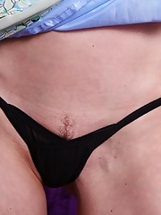 Mature Nora Noir slips out of her dress and shows off her sexy body