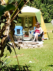 MILF in a pink top and denim bottoms gets naked to boink at campground