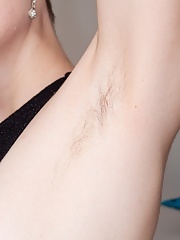 Redhead Ginta wearing a sexy black dress strips to masturbate