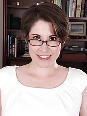 Short haired brunette modelling in white panties to show off her smooth slit