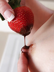 Skinny Celeste Carpenter slips a strawberry in her pussy
