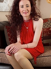 Stockings wearing mature redhead Scarlet Martini stuffing her hairy pussy with dildo