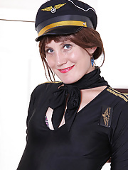 Sultry redhead Katrina Mathews is dressed up as a sexy airline pilot