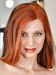 Petite redhead Lina Arian in mini black dress plays with her pussy