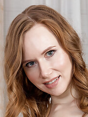 Slim beauty Veronica S poses and slowly strips her clothes getting naked