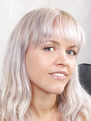 Beautiful blondie Jessy Fiery poses in her white corset and expresses her bush