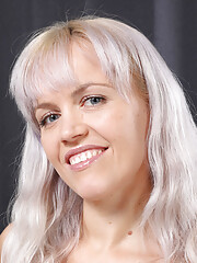 Small titted mature babe Jessy Fiery touching her hairy pussy on the bed