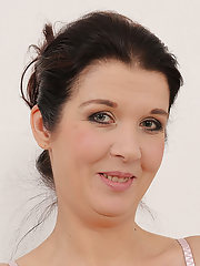 38 year old Fernanda Jerson gets her big titties wet on the glass table